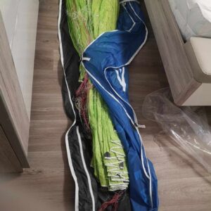 new 777 King 2 Paraglider - A brand new, colorful paraglider lays gently on a room floor, its vibrant fabric hinting at the thrill of flight it offers.