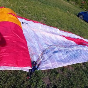 wing Mito Paraglider Spreaded on Green Grass. Swing Mito, Paraglider, EN A, Beginner Glider, Super Safe, Forgiving, Easy Takeoff, Mint Condition, Low Hours, Best Buy