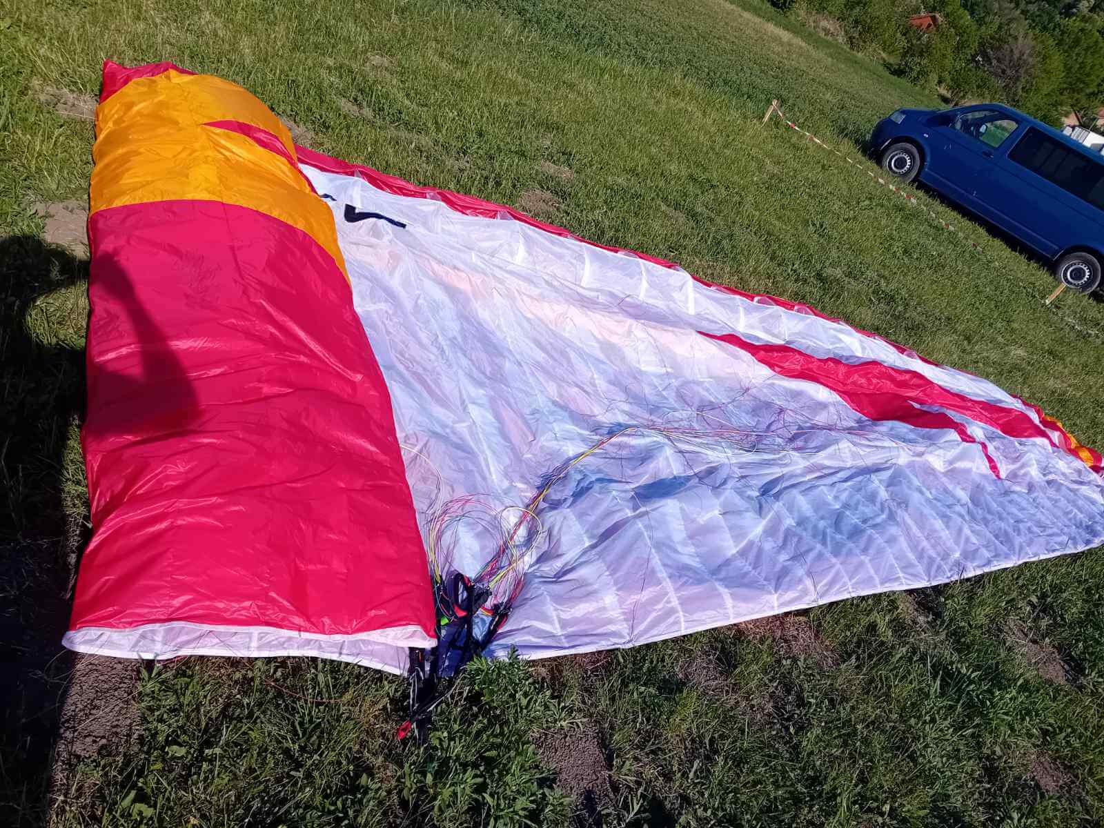wing Mito Paraglider Spreaded on Green Grass. Swing Mito, Paraglider, EN A, Beginner Glider, Super Safe, Forgiving, Easy Takeoff, Mint Condition, Low Hours, Best Buy