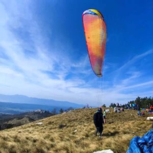 "BGD Base 2 paraglider for sale in excellent condition, fire red-orange color, size M, perfect for cross-country flights."