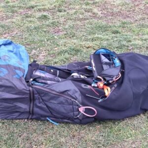 Used Kortel Kanibal Race 2 paraglider harness in good condition, perfect for long XC flights and competitive pilots, photographed indoors in Montenegro