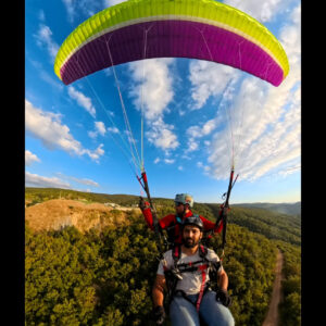 Tandem Troy T-Win 2 paraglider in flight during photo demo session – new tandem wing for serious pilots.